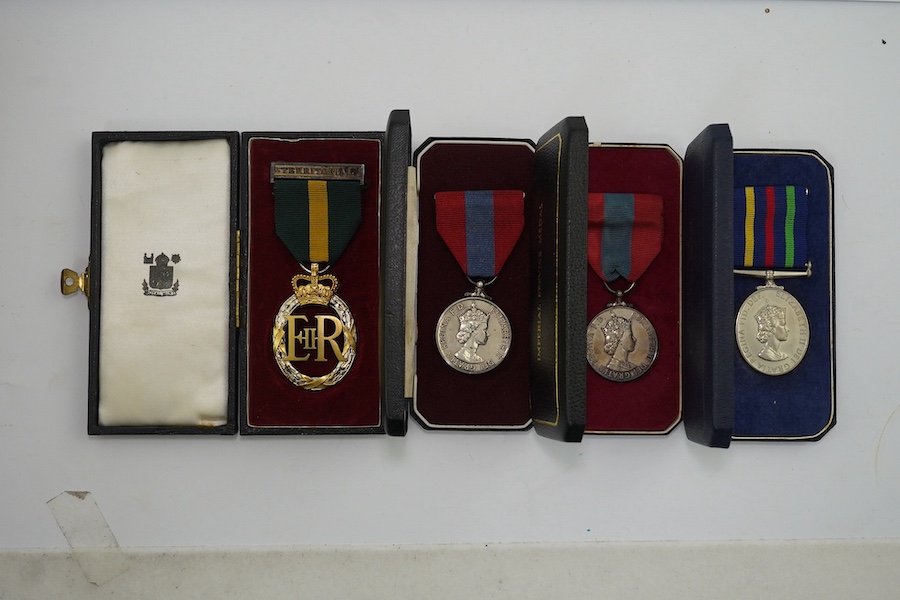 Four ERII service medals; Imperial Service medal to Alexander Manuel, another to Sydney John Jeffery (Technician Class IIA, Telecommunications Headquarters; Civil Defence Long Service unnamed; Territorial Efficiency Deco